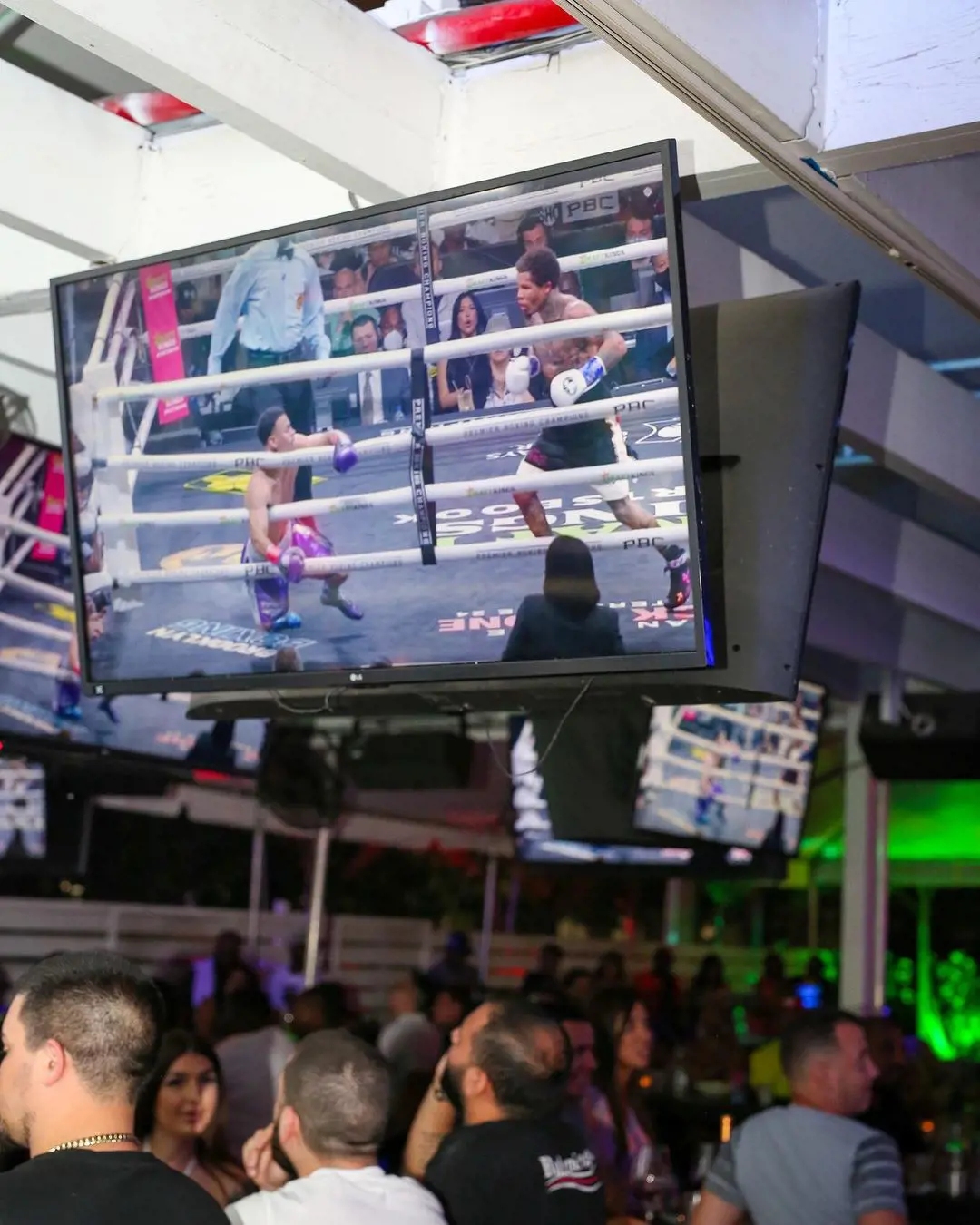 Grails Sports Bar playing the boxing game on-screen and entertaining its customers