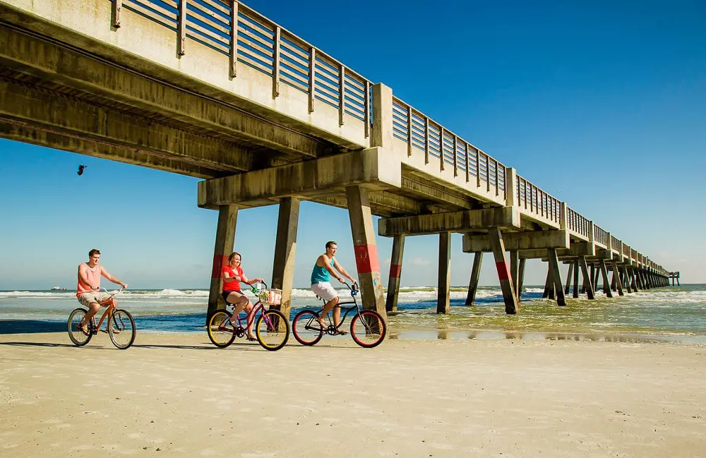 Enjoy cycling at the shore of Jac beach along with the pier